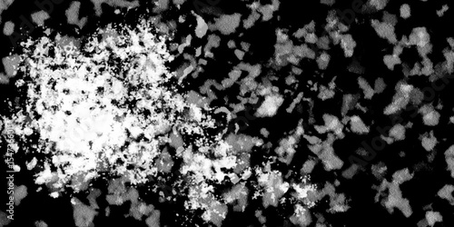 Snowflakes on dark background. white icy snowflakes isolated on black background, natural background. white crystalline powder on a black background. sugar dust. texture, pattern and clipping.