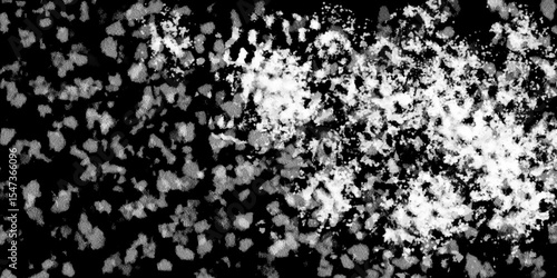 Snowflakes on dark background. white icy snowflakes isolated on black background, natural background. white crystalline powder on a black background. sugar dust. texture, pattern and clipping.
