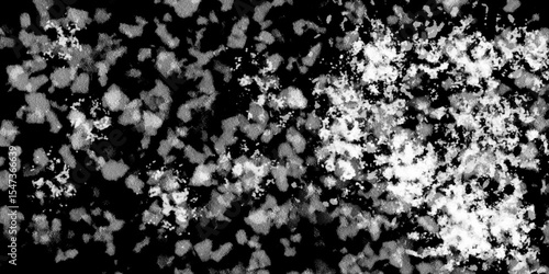 Snowflakes on dark background. white icy snowflakes isolated on black background, natural background. white crystalline powder on a black background. sugar dust. texture, pattern and clipping.