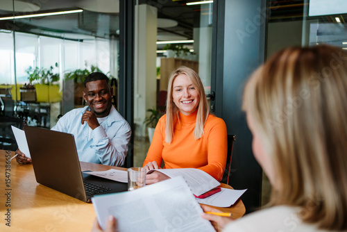 Colleagues having a business meeting in a modern office