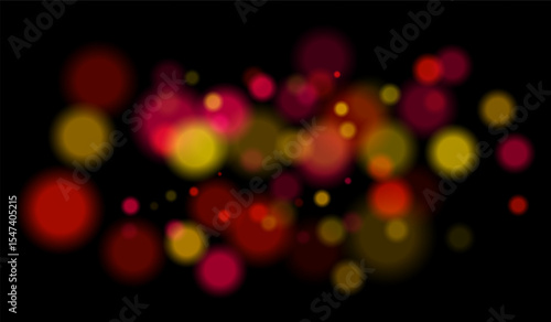 Multicolored blurred bokeh particles with violet, blue, pink hues floating on black background, creating festive or dreamy abstract composition.