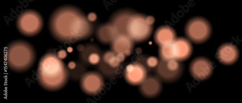 Orange blurred bokeh particles with varying size and opacity on black background. Abstract design element for festive or sci-fi scenes.