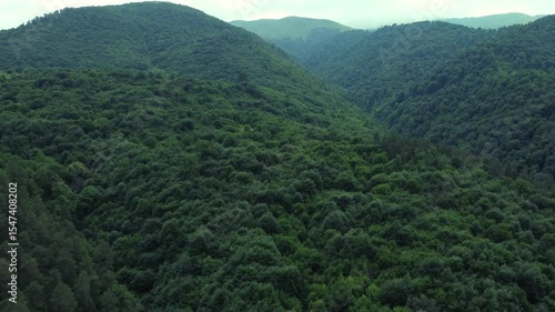 Aerial revealing shot of the vast mountains and forestry of Dilijan in Armenia. Tourist destination for hiking trails and lakes.