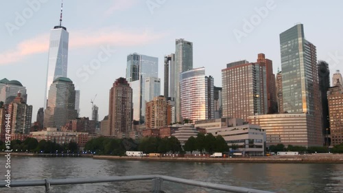 New York City skyline from ferry boat to Staten Island. Manhattan downtown. World Trade Center skyscraper from ferryboat. River waterfront sunset panorama, riverfront buildings architecture, FiDi, USA