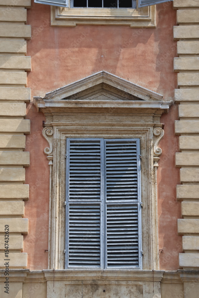 Fototapeta premium Old windows with shutters on an old house in Siena, Italy