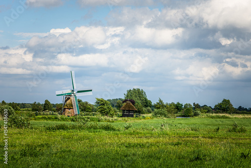 Fényképezés Windmill in rural landscape, Bedekaspel, Grosses Meer, Suedbrookmerland, East Fr