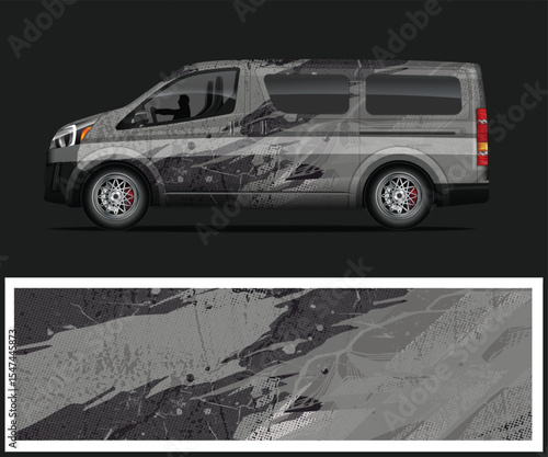 Van with Abstract Camouflage Wrap Design on a Dark Background