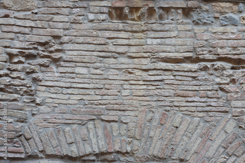 Obraz premium close up of brick wall texture of and historic building in Siena, Italy