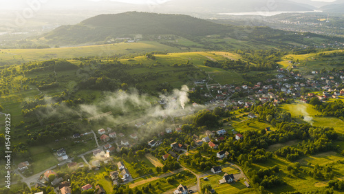 Fototapeta Naklejka Na Ścianę i Meble -  Widok z drona na Beskid Żywiecki i miejscowość Trzebinia i góra Grojec. 