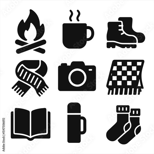 Cozy Fall Icons. Solid, filled icons set of cozy fall activities: bonfire, warm drink, hiking boots, knit