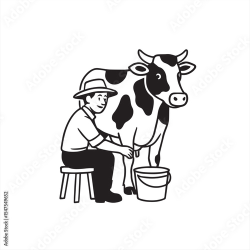 man milking cow
