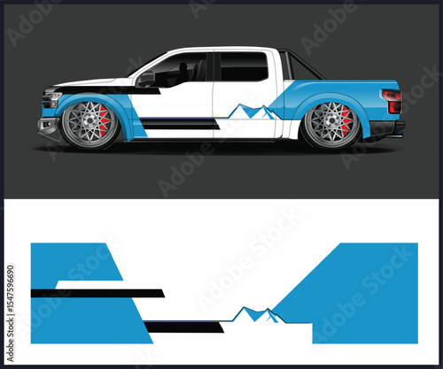 Modern white and blue pickup truck with mountain graphic wrap and custom wheels