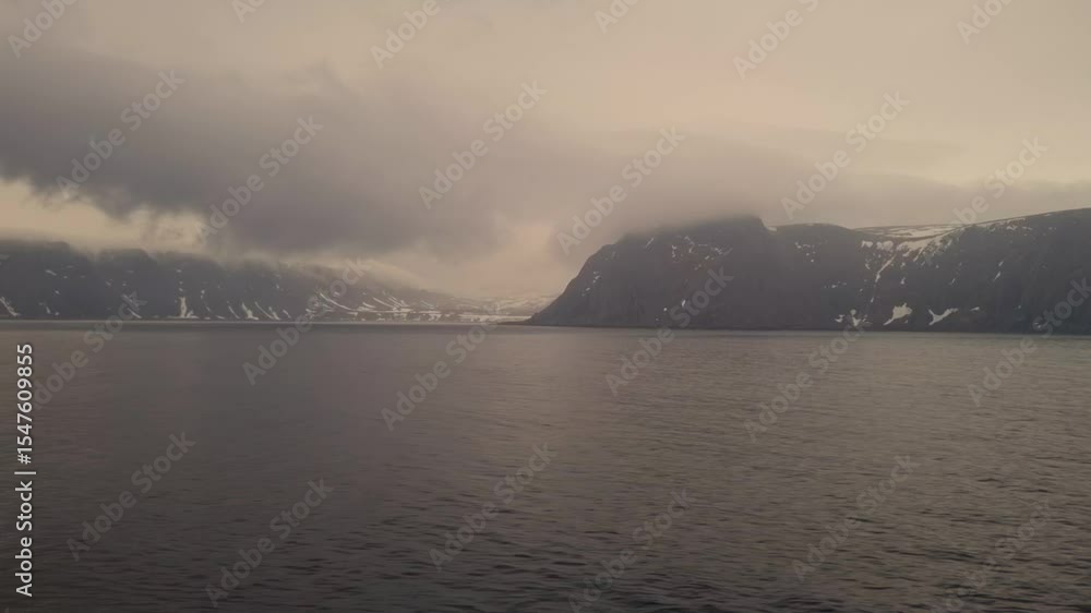 The view of clouds and mist from the deck of a cruise ship sailing along the coast of Norway The view of clouds and mist from the deck of a cruise ship sailing along the coast of Norway