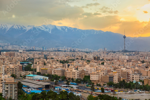 Beautiful cityscape sunset panorama of Tehran city, mountains and Milad tower in during colorful sunset in Iran