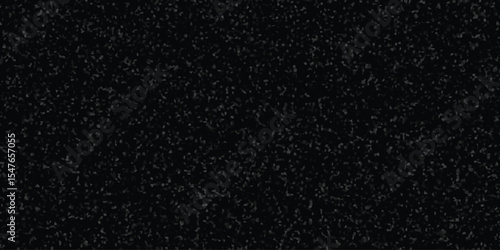 Dark textured surface with small grained elements forming a subtle pattern representing a dense field or microscopic structure