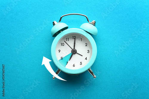 Alarm clock on color backgr...