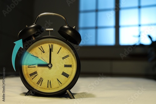 Alarm clock on bed, closeup...
