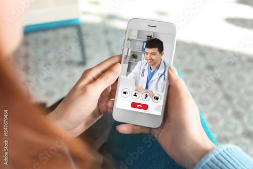 Woman using mobile phone in...