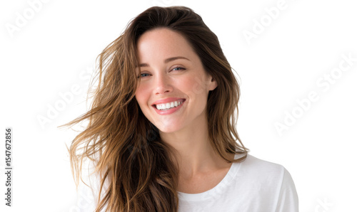A cheerful young woman with long. flowing hair smiles warmly at the camera. set against a soft. neutral background. conveying a sense of happiness and positivity ideal for lifestyle imagery