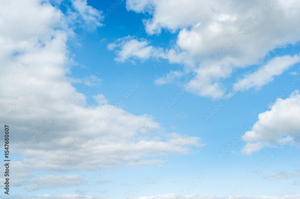 A Vast and Beautiful Blue Sky Above, Filled with Soft and Fluffy Clouds Drifting Calmly A Vast and Beautiful Blue Sky Above, Filled with Soft and Fluffy Clouds Drifting Calmly