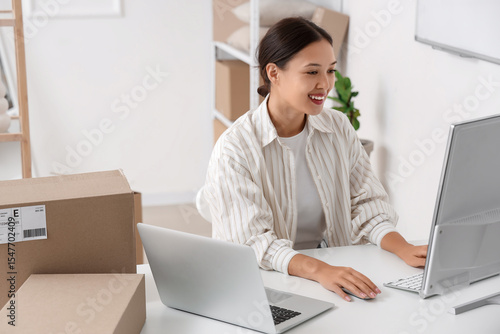 Female Asian seller working...