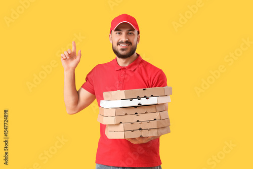 Male courier with pizza box...