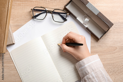 Woman writing something in ...