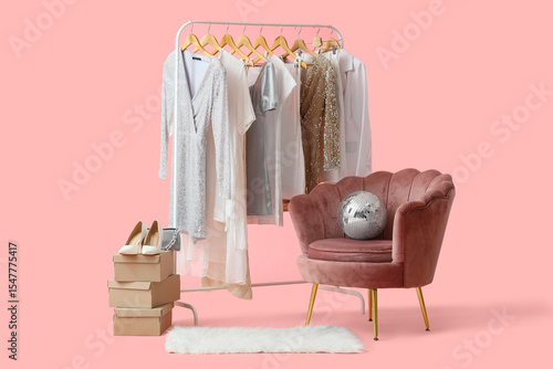 Rack with stylish clothes, ...