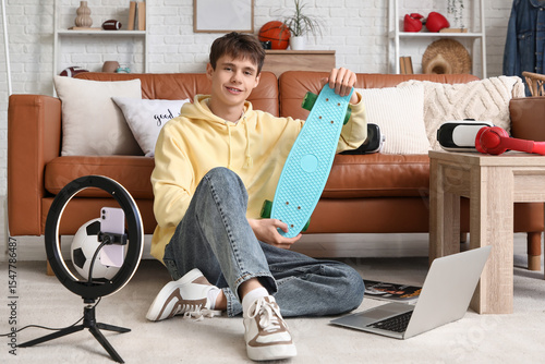 Teenage blogger with skateb...
