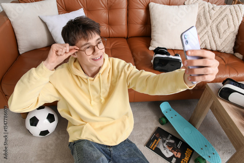 Teenage blogger with mobile...