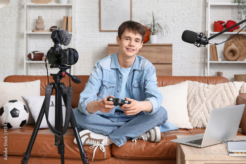 Teenage blogger with game p...