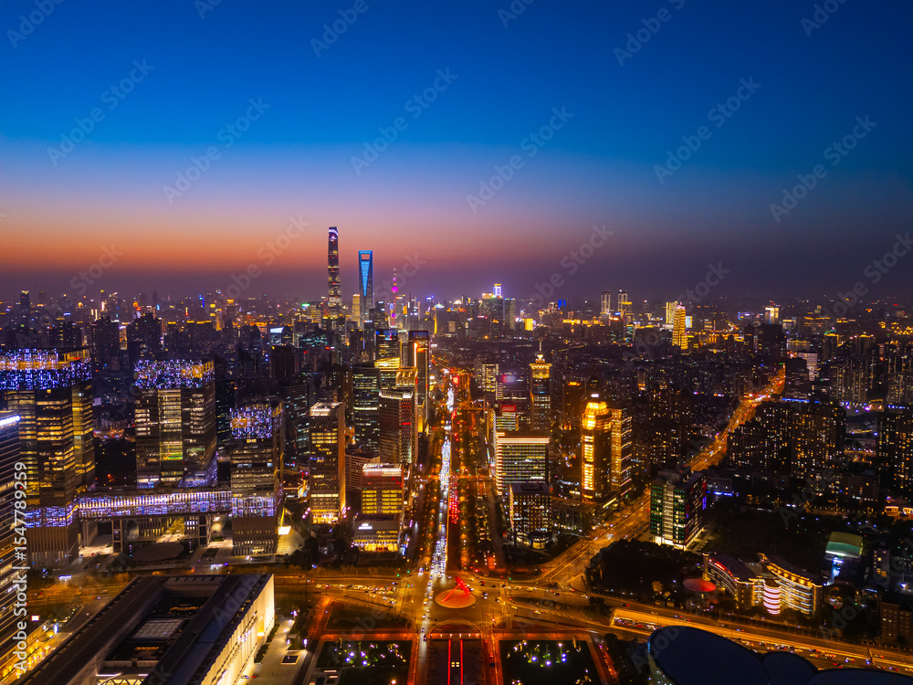 Fototapeta premium Aerial view of Shanghai skyline in downtown at night.