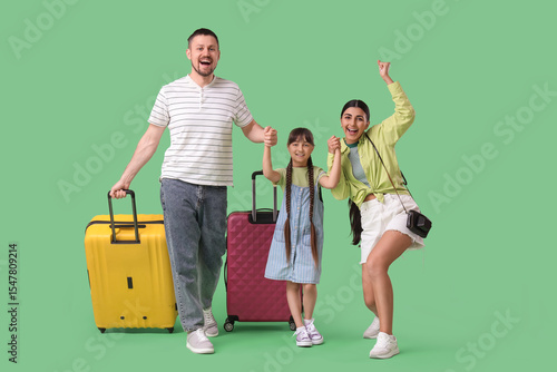 Family of tourists with sui...