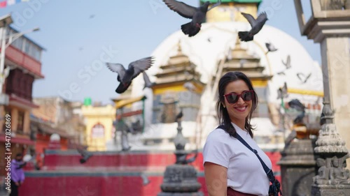 Smiling Woman at Kathmandu Temple with Flying Pigeons


