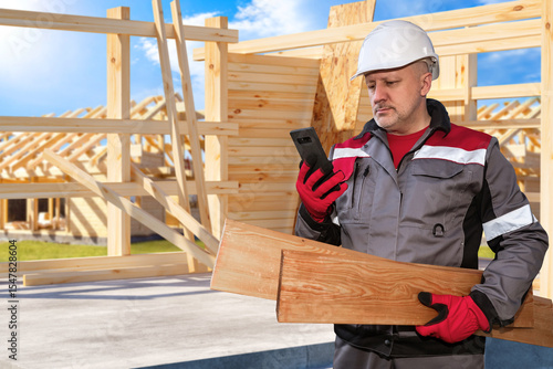 Man building house from woo...