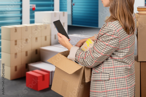 Woman near storage unit. Gi...