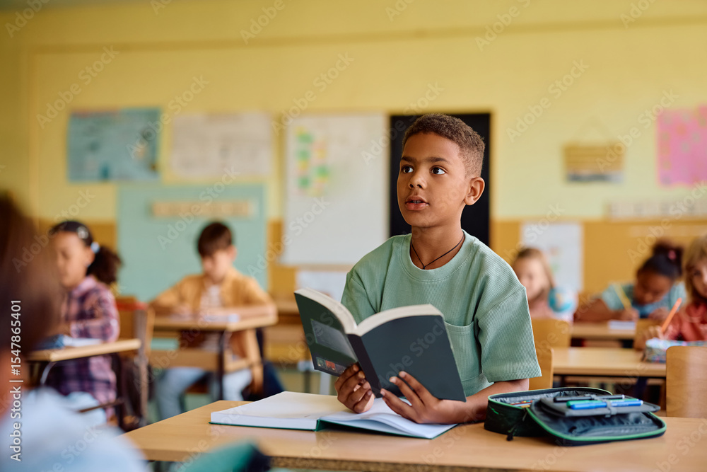 Black student learning during class at elementary school. Black student learning during class at elementary school.
