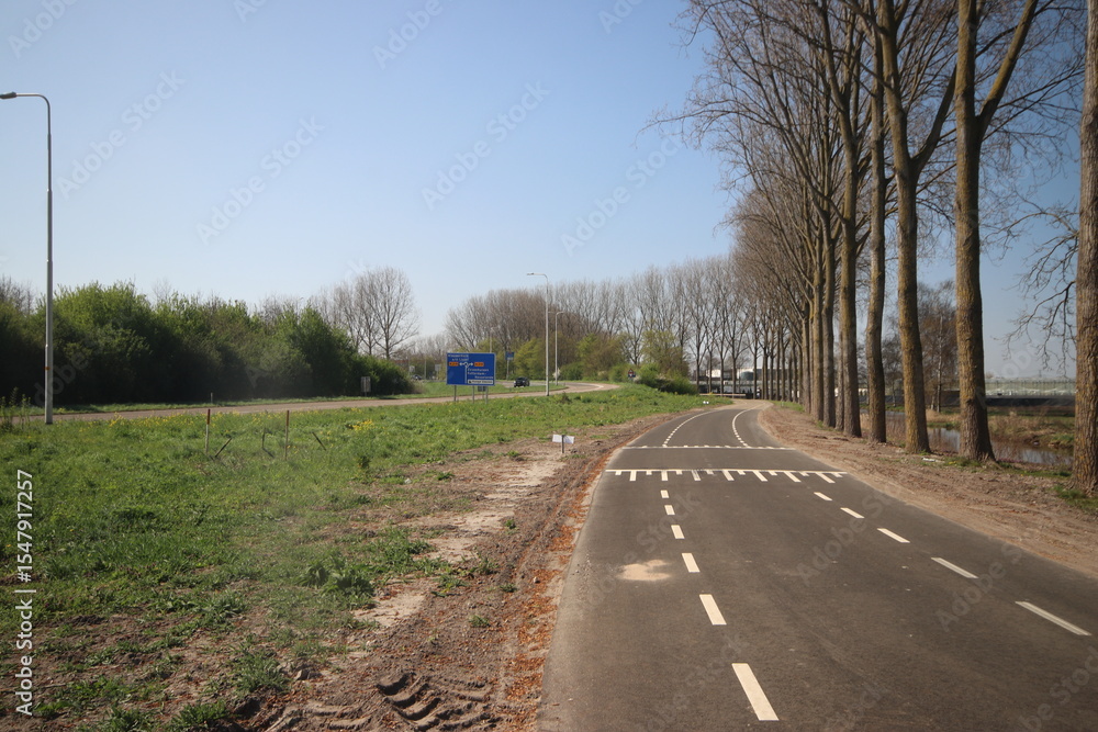 Fototapeta premium Meadows, fields and roads in the Middengebied area where new village Cortelande will arise