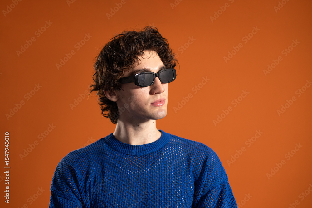 Obraz premium Young Man Posing in Sunglasses