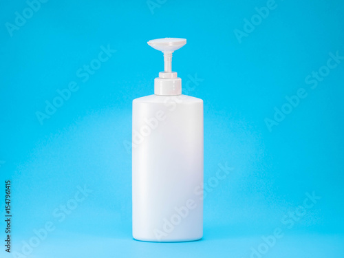 White Plastic Pump Bottle on Blue Background