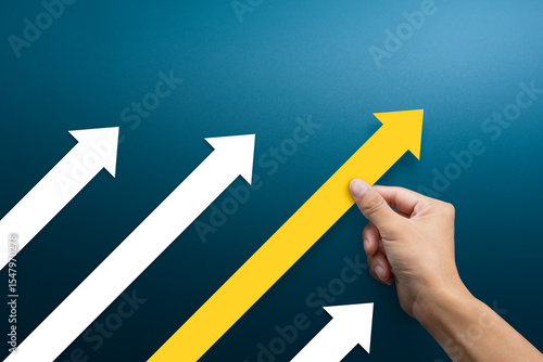 Business competition concept. Businessman pushing arrow up.