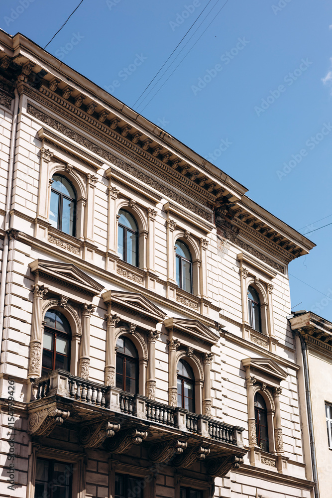 Facade of an old historic building in a European city, vintage architecture. Facade of an old historic building in a European city, vintage architecture.
