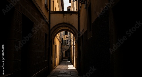 Dramatic Light and Shadow in a Narrow Italian Alley with Arched Passageways.