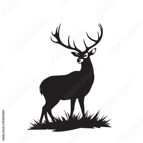 A deer silhouette stands in the grass isolated on white background