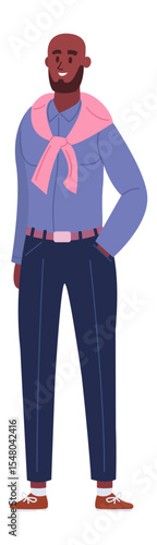 Full length portrait of a dark skinned man with a beard and bald head, wearing a pink scarf, blue shirt and dark blue pants, smiling with one hand in his pocket