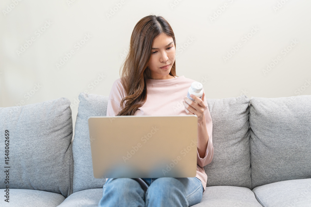 Fototapeta premium person read pills label and check information in smartphone