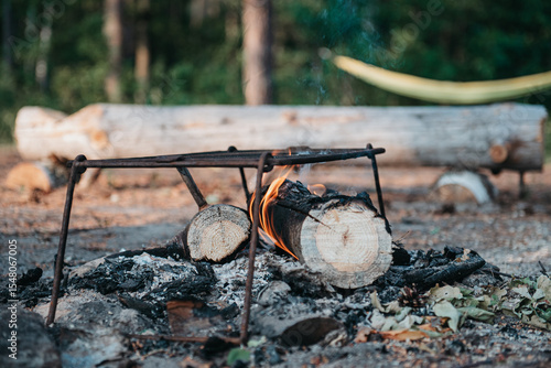 bonfire in nature against the background of tents
