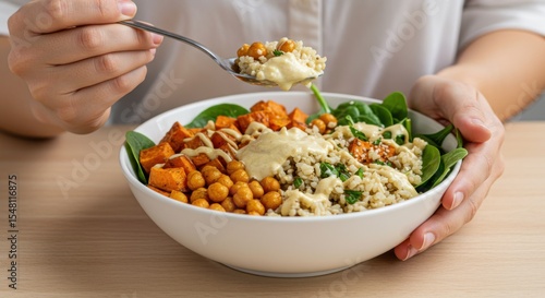 Plant based food, Buddha bowl, Healthy lunch, Close-up of a woman enjoying a fresh, healthy salad bowl with crisp vegetables and chicken for a delicious lunch, avocado