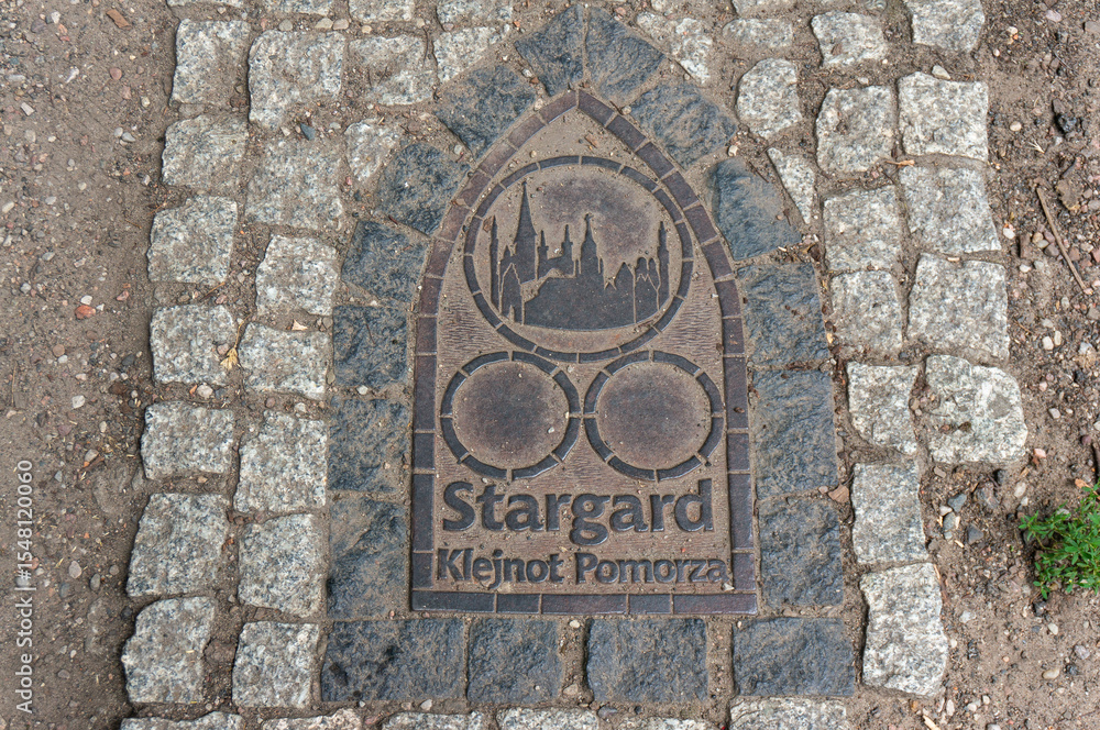 Pavement metal plaque. City called Pavement metal plaque. City called