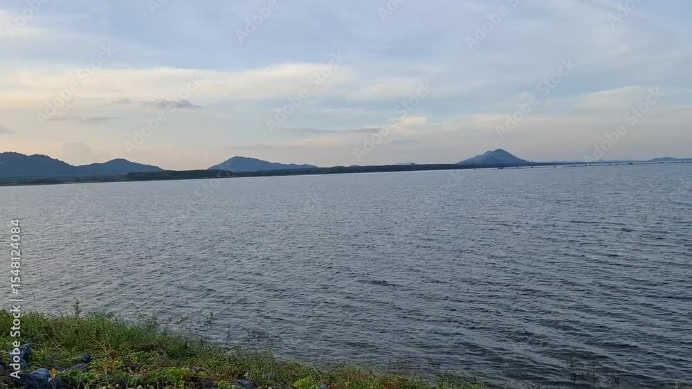 Peaceful Lake View with Mountain Horizon at Sunset Peaceful Lake View with Mountain Horizon at Sunset